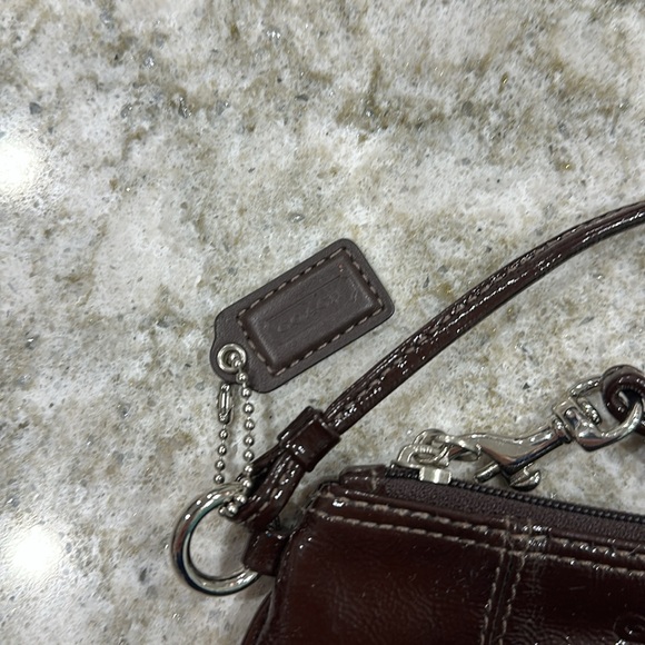 COACH WRISTLET in brown  with silver tone hardware and COACH LOGO TAG - Picture 3 of 5